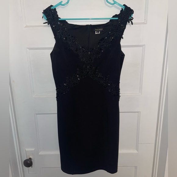 NIKIBIKI Off the Shoulder Black Mini Dress with Front Detailing - Picture 2 of 3